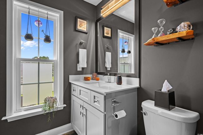 Bathroom featuring toilet and vanity | Image 28