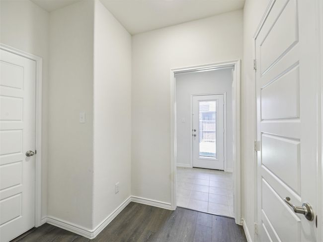 Hallway featuring dark wood-style floors and baseboards | Image 10