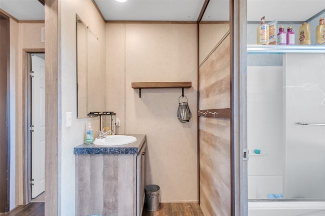 Bathroom with vanity, wood finished floors, and walk in shower | Image 33