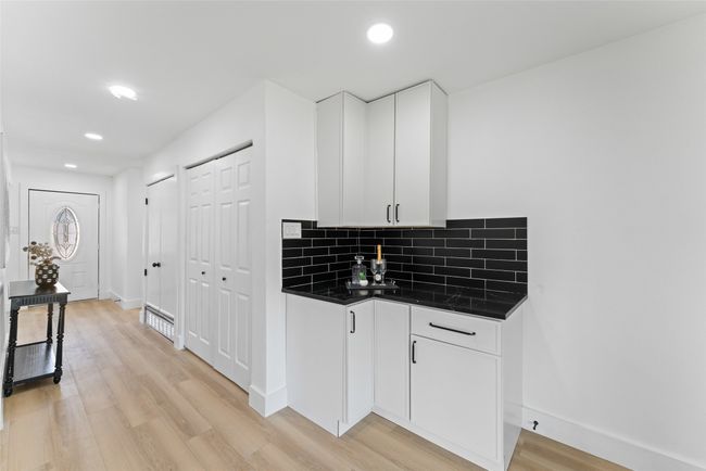 Bar featuring tasteful backsplash, light wood-style floors, and recessed lighting | Image 11