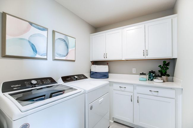 The upper level of the Jordan floorplan features a laundry room with plenty of cabinets, making it easy to keep up with household chores. | Image 26