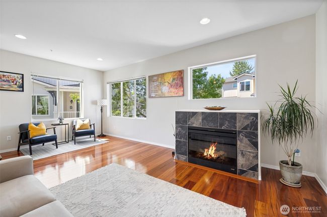 View #3 of Living Room with electric fireplace, reading space and Brazilian hardwood floors | Image 9