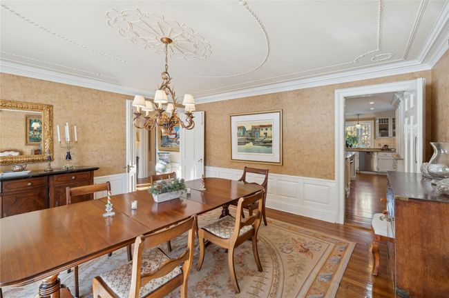 Alternate view of the dining area with view of kitchen entrance | Image 13