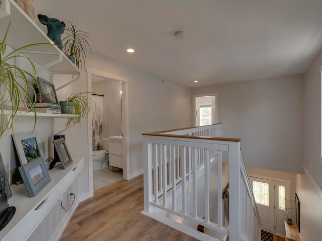 Hallway featuring baseboards, an upstairs landing, light wood-type flooring, and recessed lighting | Image 18