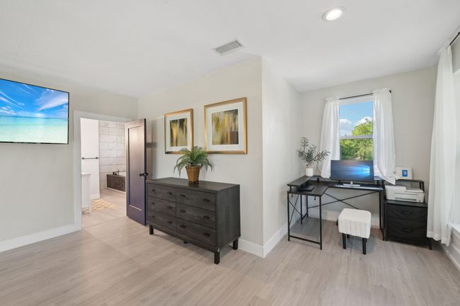 Office area featuring wood finished floors, baseboards, and recessed lighting | Image 20