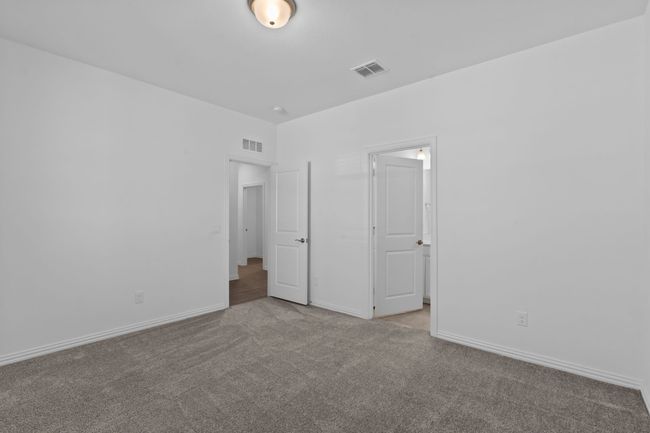 Unfurnished bedroom with carpet flooring and baseboards | Image 13