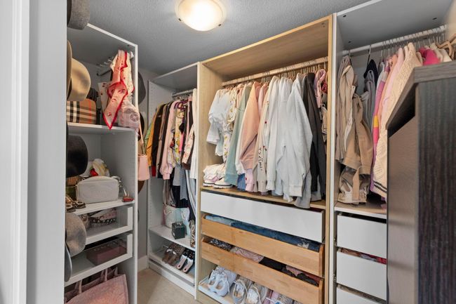 Walk in closet featuring carpet floors | Image 20