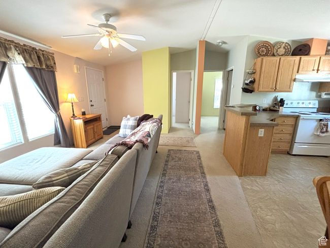 Living area with ceiling fan | Image 6