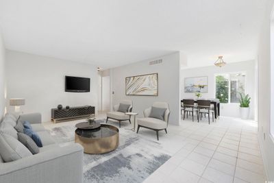 Living room with light tile flooring | Image 3