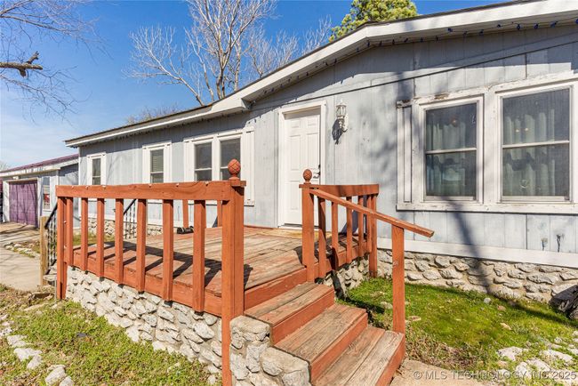 Featuring a large front porch that is great place for a rocking chair. | Image 8