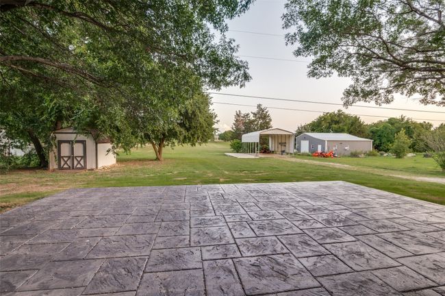 View of patio featuring a shed | Image 23