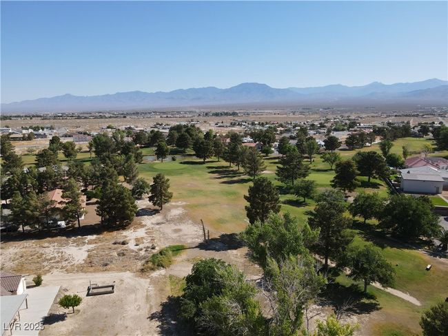 Mountain view featuring a golf course and nearby suburban area | Image 56