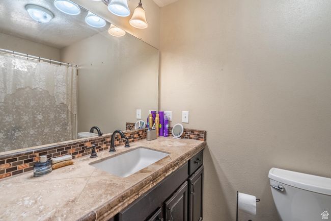 Bathroom featuring backsplash and vanity | Image 35