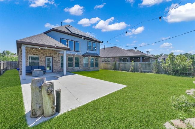 Take a look at your beautiful new backyard!!! It has a fantastic partially covered extended back patio complete with a gas line for a grill or outdoor kitchen buildout in the future. | Image 31
