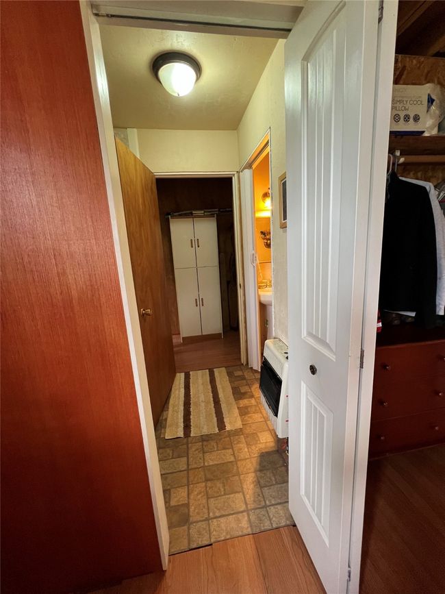 hallway from main bedroom to bathroom | Image 49