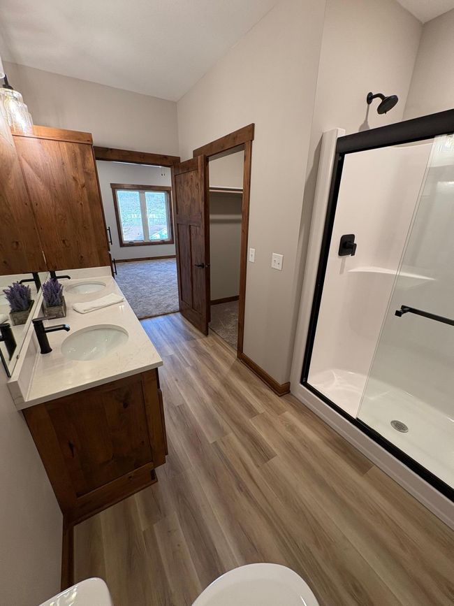 Primary Bath with walk-in-closet on right and Primary Bedroom Beyond | Image 22