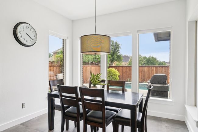 Dining space featuring baseboards and concrete floors | Image 6