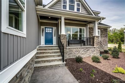 View of exterior entry with covered porch | Image 2