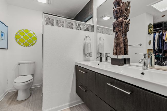 Primary bath featuring updated vanity and shower | Image 16