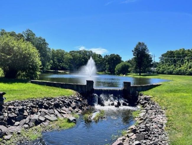View of property's community featuring a water view and a yard | Image 24