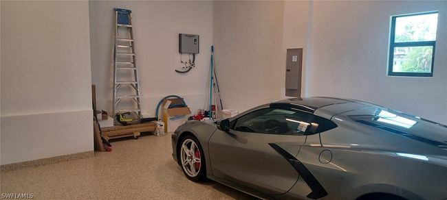 12'-6" garage ceiling with tankless water heater and extra storage space. | Image 21