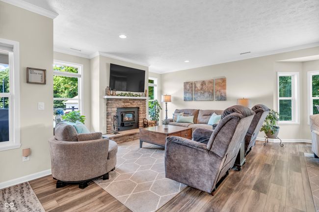 stone surround, wood burning fireplace w/insert & blower | Image 17