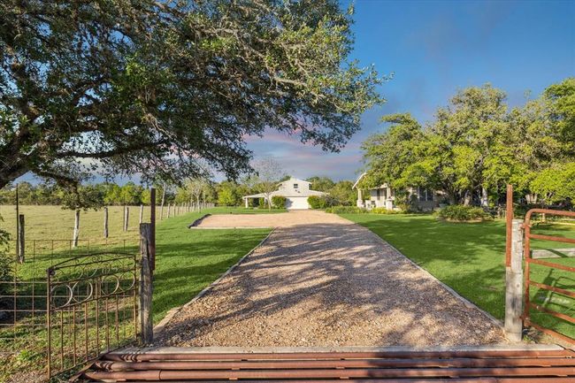 Driveway entry to the house and garage. | Image 50