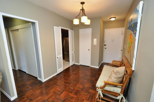 Dining Foyer featuring baseboards and a notable chandelier | Image 26