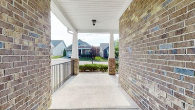 Large covered front porch provides a private, quiet place to relax | Image 3