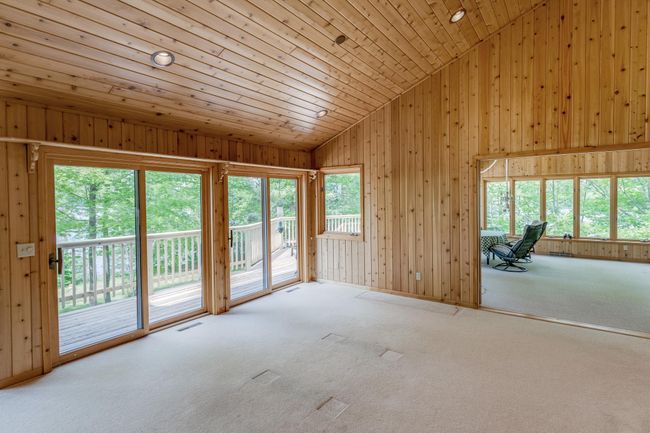 Large patio doors lead out to the lake side deck! | Image 18