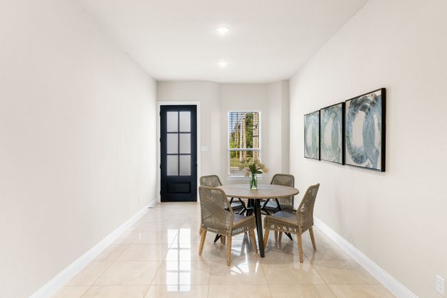 Dining space with light tile patterned flooring, recessed lighting, and baseboards | Image 10