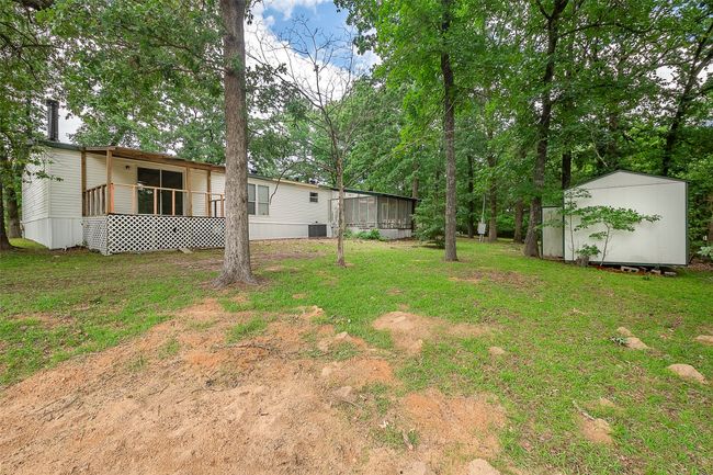 View of green lawn with a sunroom | Image 21