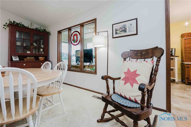This owner chooses to have an additional table in the Living Room | Image 10