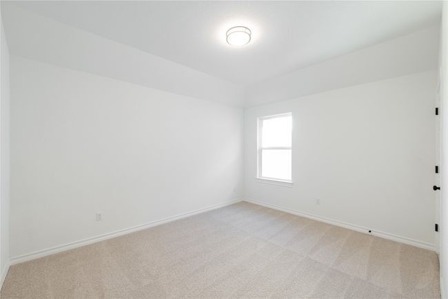 Empty room with light carpet and vaulted ceiling | Image 15