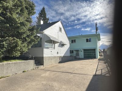 Back of house featuring a garage | Image 1