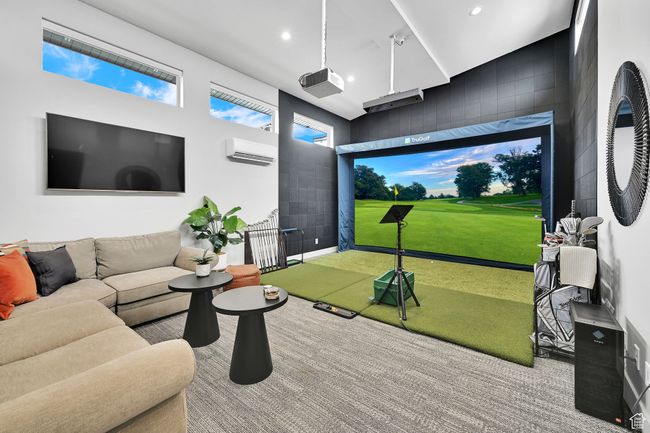 Game room featuring golf simulator, a wall unit AC, carpet, and recessed lighting | Image 55