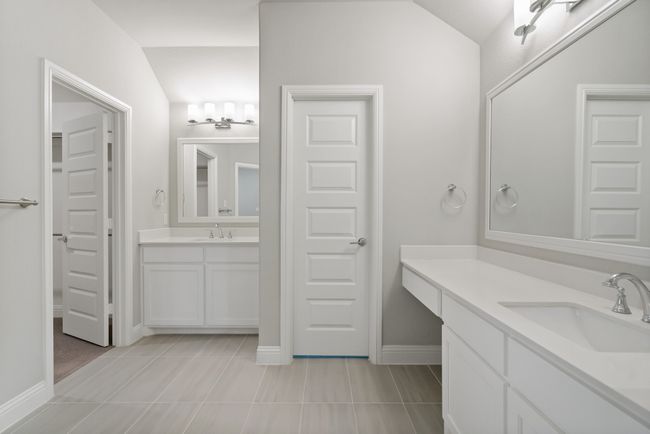 Full bathroom featuring tile patterned flooring, a sink, two vanities, and baseboards | Image 21