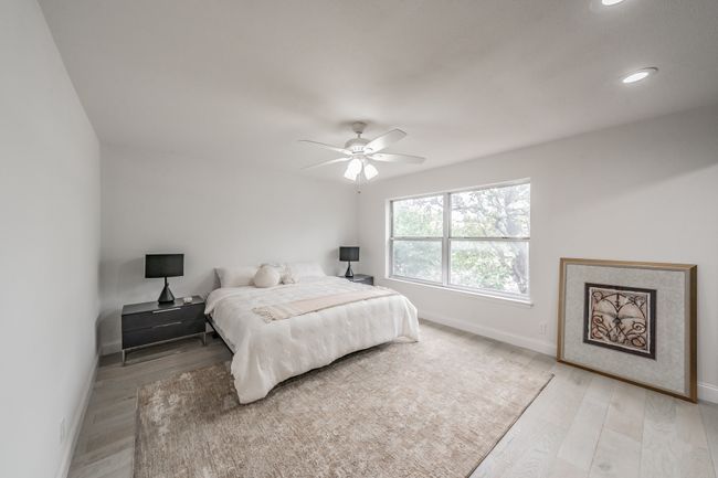 Bedroom featuring ceiling fan, baseboards, light wood-style floors, and recessed lighting | Image 10