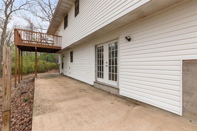 View of patio / terrace featuring a deck and french doors | Image 32