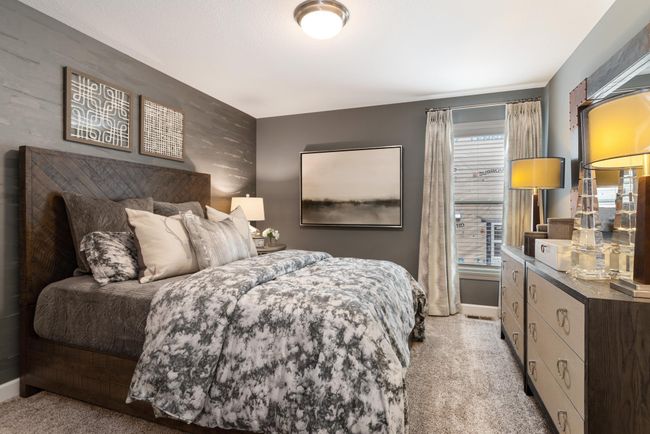 (Photo of decorated model, actual home's finishes will vary) Extremely spacious and elegant, this private owner's suite connects to a large en-suite bath providing a great oasis to relax in your own private space. | Image 13
