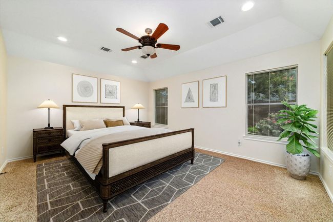 Virtually staged to showcase a bright, spacious primary bedroom and a cozy backyard — imagine the possibilities! | Image 21