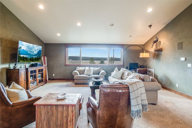 Caretaker Quarters / Guest House. Living area featuring visible vents, recessed lighting, baseboards, and vaulted ceiling | Image 77