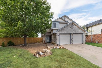 View of front of property with a front yard and a garage | Image 2