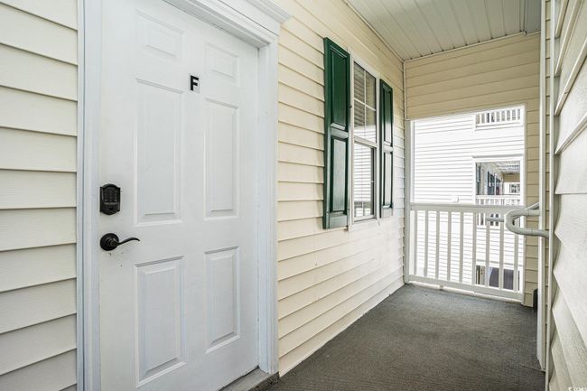 Entrance to property featuring covered porch | Image 23