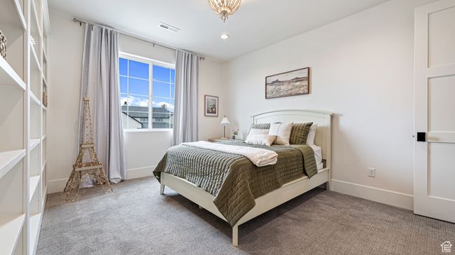 Bedroom with baseboards, visible vents, recessed lighting, and light colored carpet | Image 48
