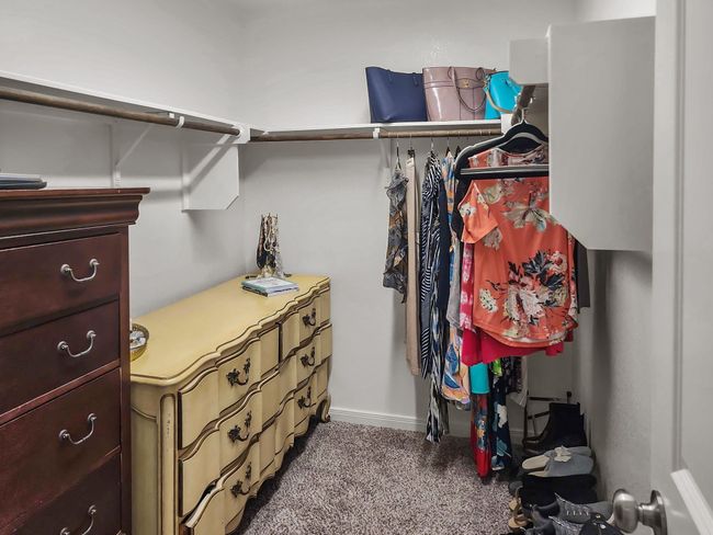 Walk in closet with carpet floors | Image 17