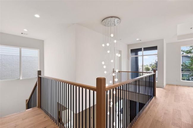 Top down view of the entry way with this unique and luxury chandelier | Image 4
