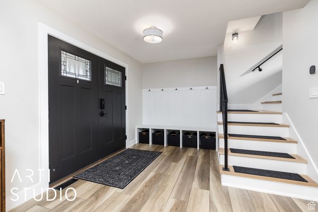 Entryway with stairway and wood finished floors | Image 5