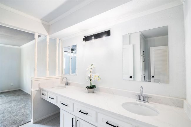 This charming area includes a vanity. | Image 25