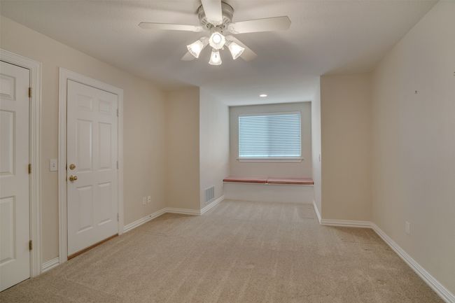 Spare room with carpet floors, a ceiling fan, and baseboards | Image 27